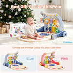 A baby activity gym and play mat set shown in a cozy holiday living room with a baby sitting on the mat. The set includes a blue and white activity frame with hanging toys, a round play mat, and the product box.